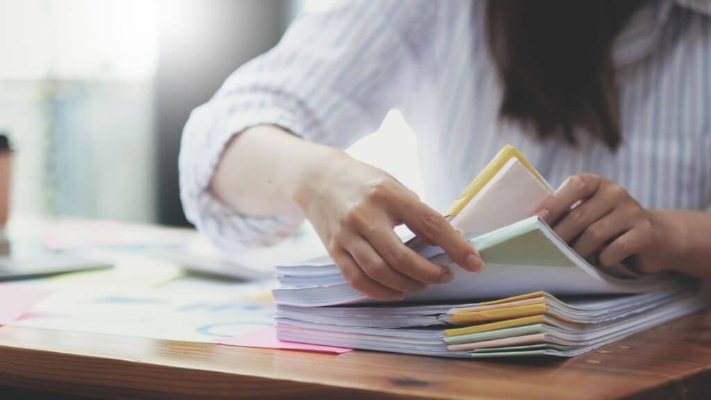 Lawyer sorting through official documents.