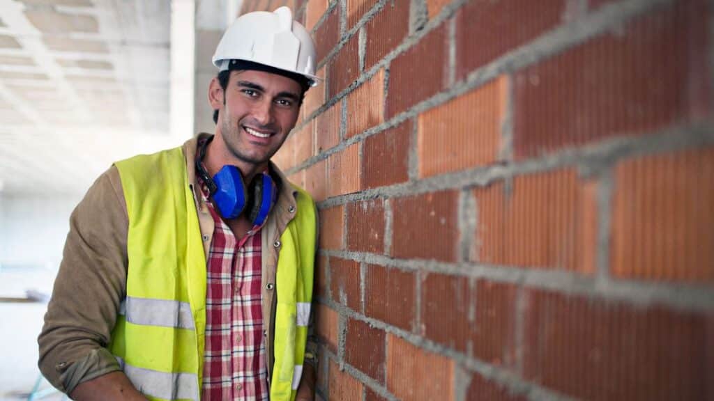 Bricklayer about to phone his builder lawyer.