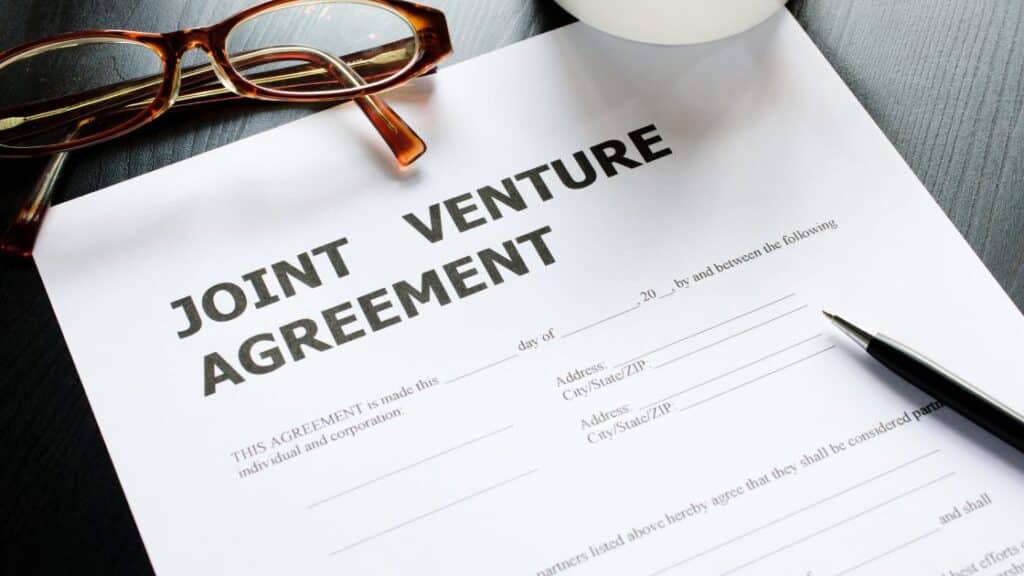 Joint venture agreement drafted on legal paper.