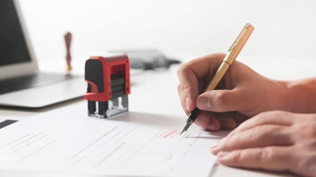 Lawyer witnessing a document signing.
