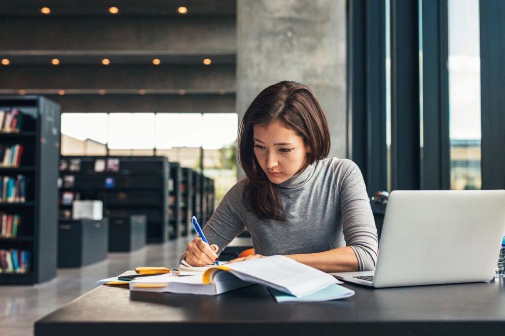 Startup business owner researching technology and innovation for her new company.