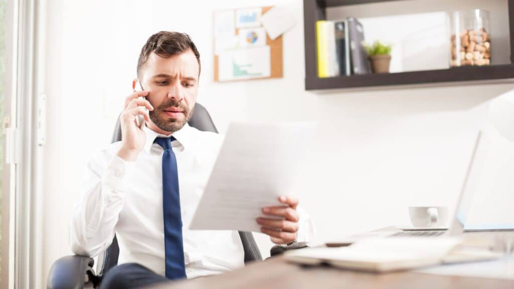 Lawyer discussing a dispute resolution over the phone.