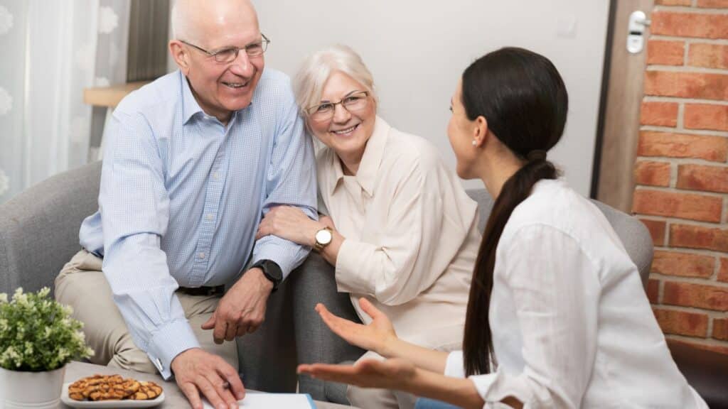 Wills lawyer discussing an estate plan with elderly clients.