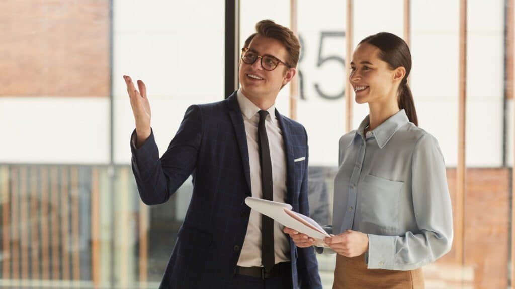 Commercial property lawyer discussing leasing agreement with prospective client.